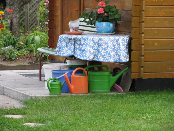 Still life with watering cans — Stock Photo, Image
