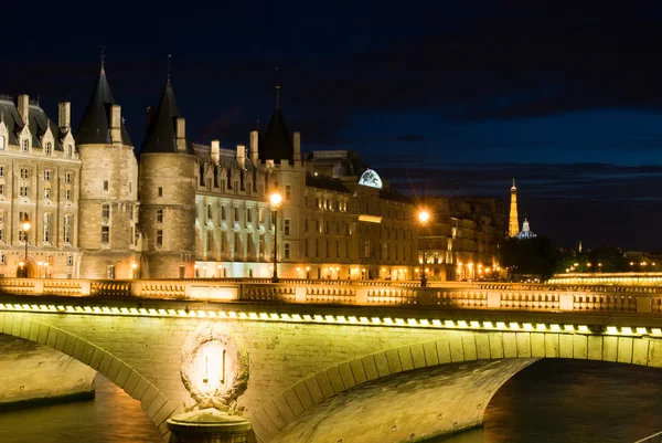 Cite island with Conciergerie and Eiffel Royalty Free Stock Photos