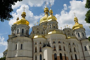 White church with golden domes clipart