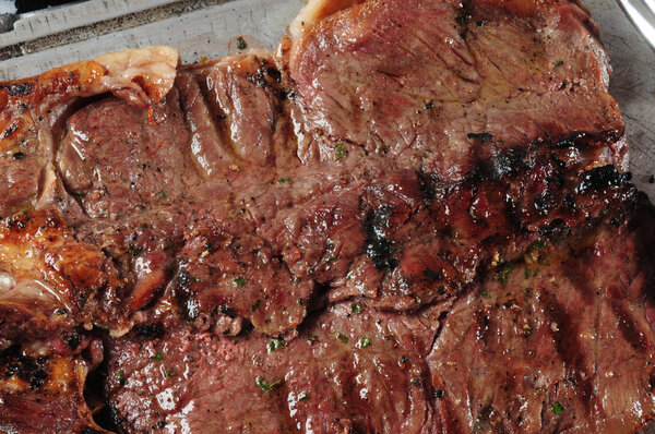 Close up of a marinated grilled meat.