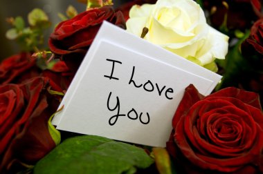 Bouquet of roses with i love you card clipart