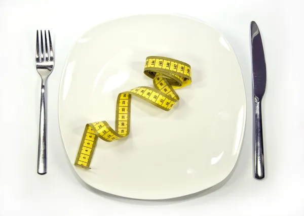 Measuring tape on a dish — Stock Photo, Image