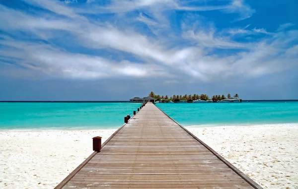 Jetty on a tropical beach — Stock Photo, Image