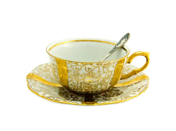 Gold porcelain cup with silver spoon — Stock Photo, Image