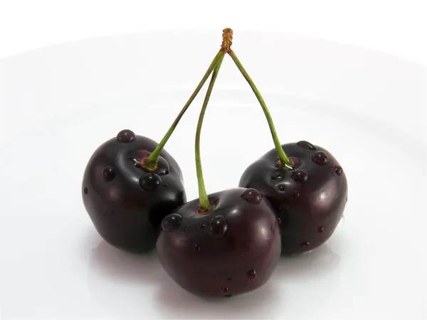 Black cherry on a plate close-up — Stock Photo, Image