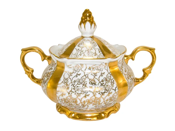 Золотая чаша с фарфоровым сахаром — стоковое фото