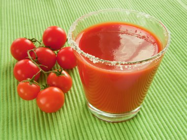 Tomato juice and sprig of cherry clipart