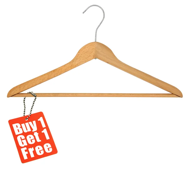 Coat hanger and sale tag — Stock Photo, Image