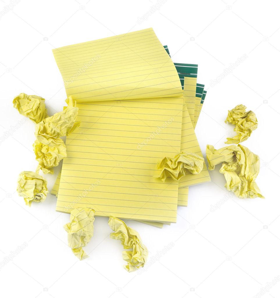Lined paper notebooks and crumpled paper