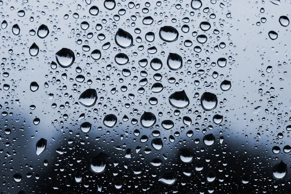 Achtergrond gemaakt van water druppels op glas — Stockfoto