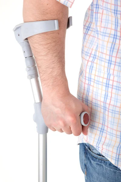 Man walking with a crutch — Stock Photo, Image