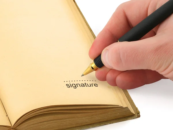 Mão escrevendo uma assinatura — Fotografia de Stock