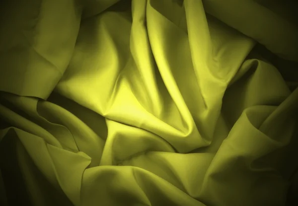 Yellow folded satin — Stock Photo, Image