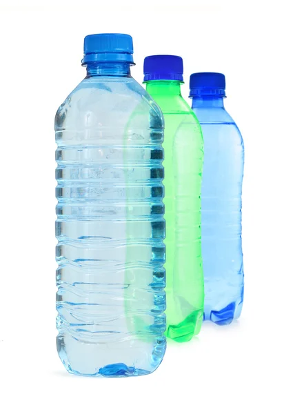 Três garrafas cheias de água — Fotografia de Stock