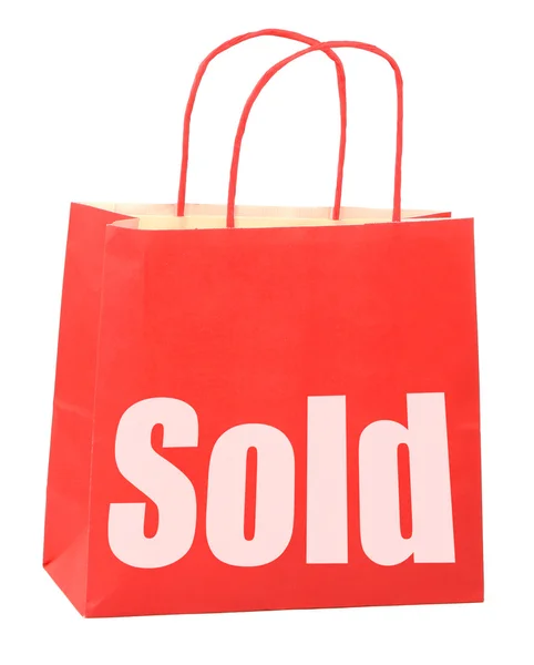 Bag with white sold sign — Stock Photo, Image