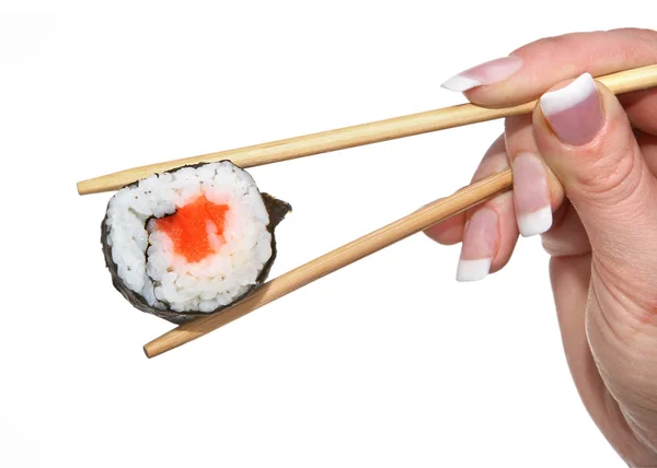 Mano femenina sosteniendo sushi — Foto de Stock