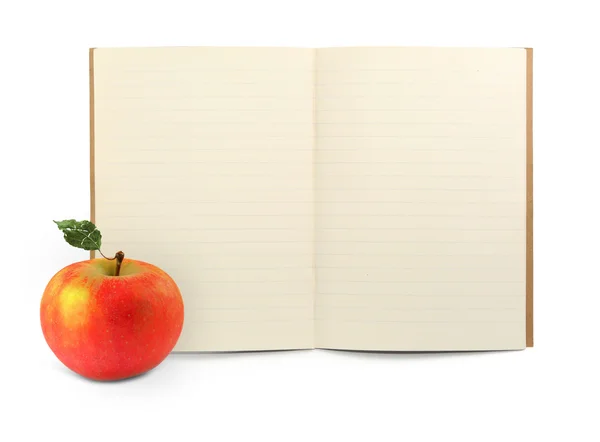 Livro de exercícios e maçã — Fotografia de Stock