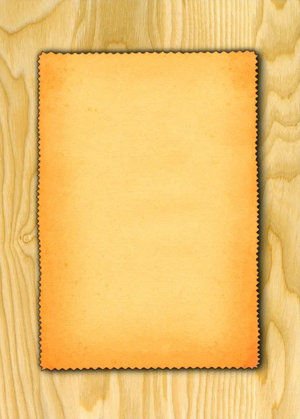 Paper against wooden background — Stock Photo, Image