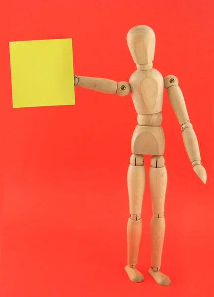 Figure holding empty adhesive note — Stock Photo, Image