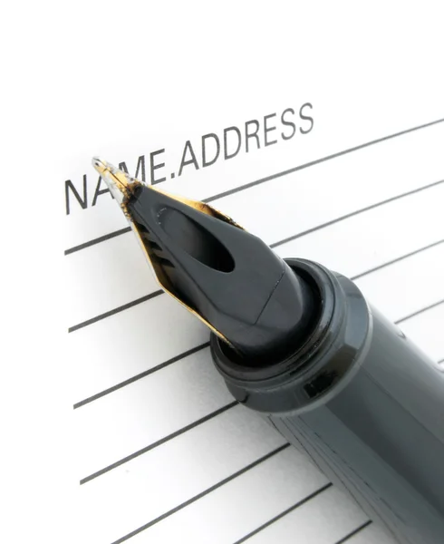 Pen tip and address book — Stock Photo, Image