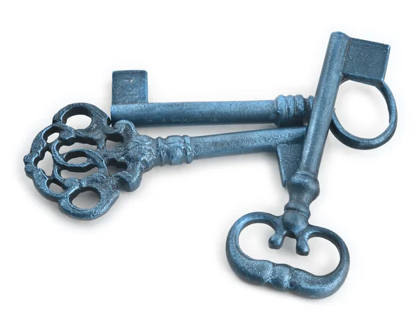 Oude sleutels in blauwe tinten tegen Wit — Stockfoto