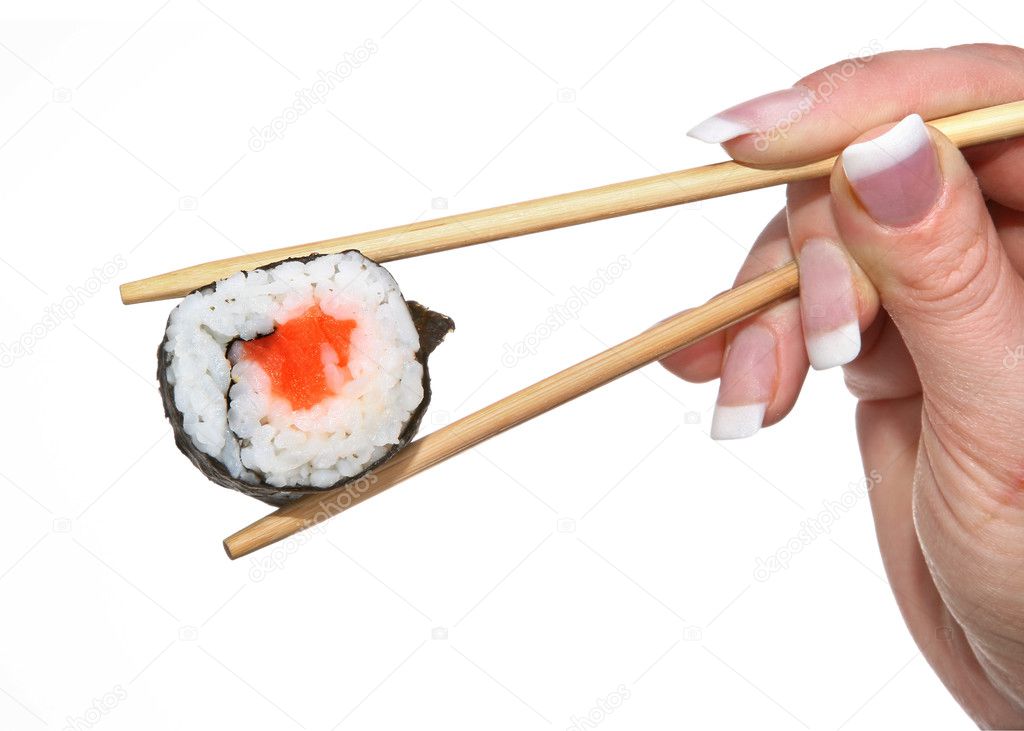 Female hand holding sushi