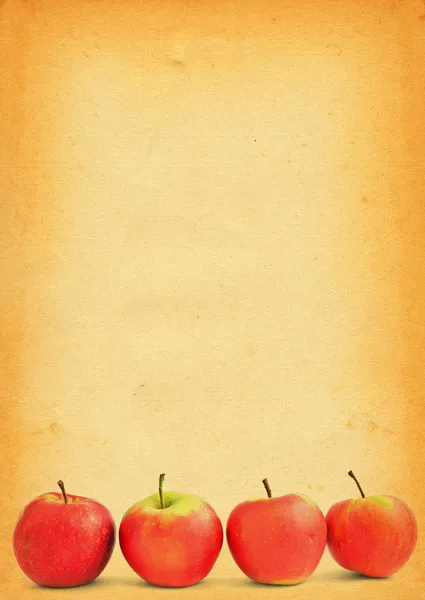 Äpplen mot gamla färgade papper — Stockfoto
