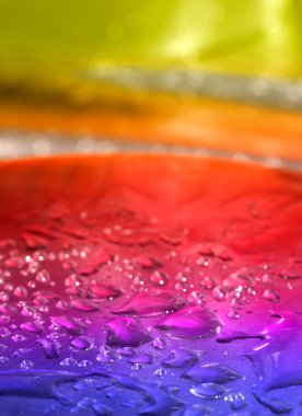 Multicolored background with water drops clipart