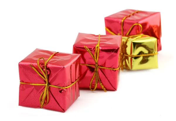 Röd nad gyllene gåvor — Stockfoto