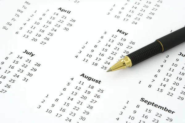 Calendar and ballpoint pen — Stock Photo, Image