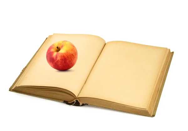 Libro aperto con mela — Foto Stock