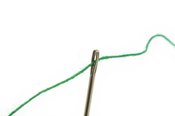 Threaded needle on white — Stock Photo, Image