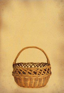Wicker basket against stained paper clipart