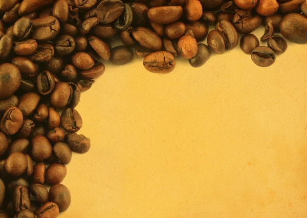 Kaffe ram på gulnade papper — Stockfoto