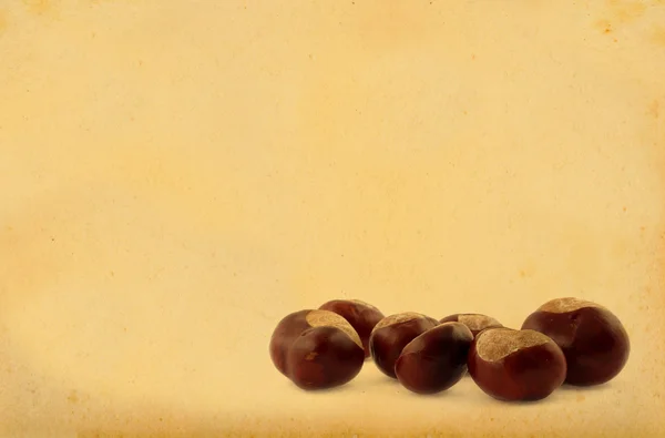 Chestnuts on retro background — Stock Photo, Image