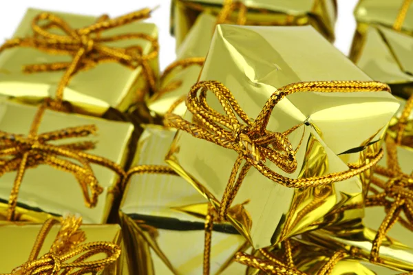 Stack of golden gifts — Stock Photo, Image
