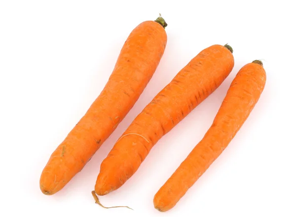 Три морковки на белом фоне — стоковое фото