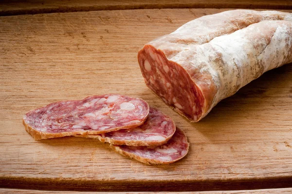 stock image Salami on a wooden board