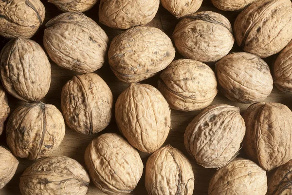 stock image Walnuts on a wooden board