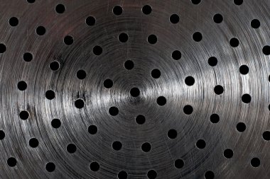 Scratched metal surface with holes clipart
