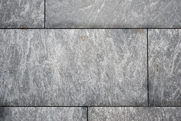 Husvägg från granit — Stockfoto