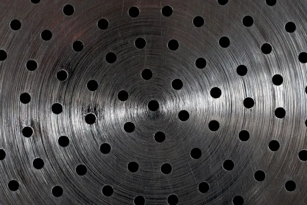 Poškrábaný povrch kovu s otvory — Stock fotografie
