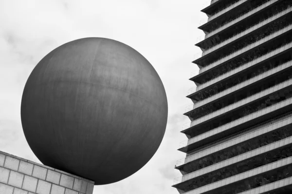 stock image Sphere near to a high building