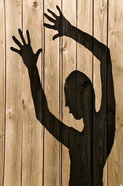 Ghost Shadow on a wooden wall — Stock Photo, Image