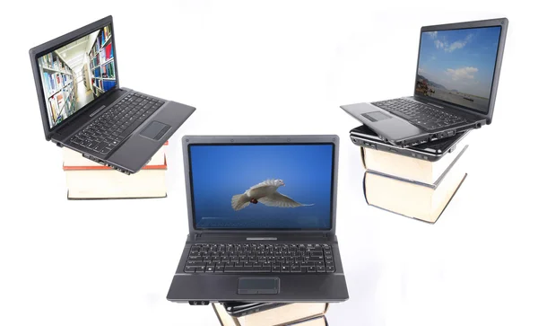 Laptop computers on thick of books — Stock Photo, Image