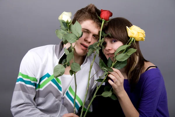 Romantic couple with roses — Stock Photo, Image