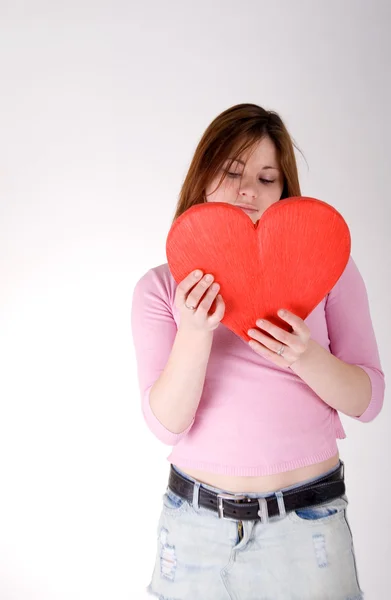 Girl holding red heart — Stock Photo, Image
