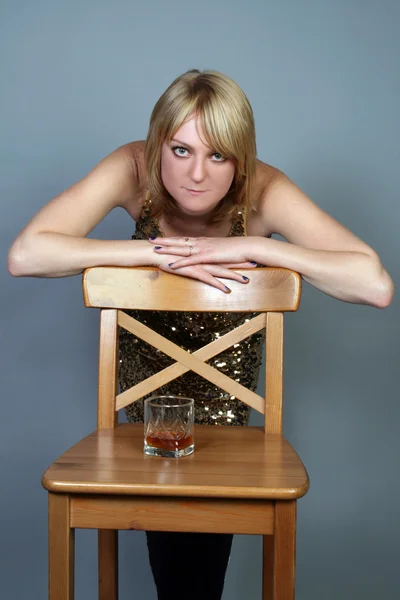 Sexy woman with a glass of whiskey — Stock Photo, Image