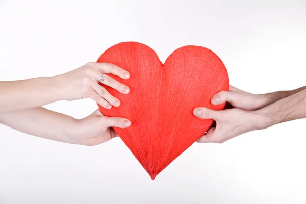 stock image Arms holding red heart