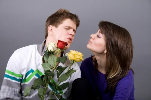 Romantic couple with roses — Stock Photo, Image